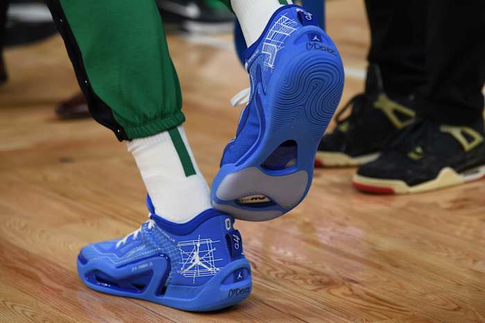 Boston Celtics forward Jayson Tatum's blue and white Jordan Brand sneakers.